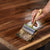 Oiling wooden counter with a brush