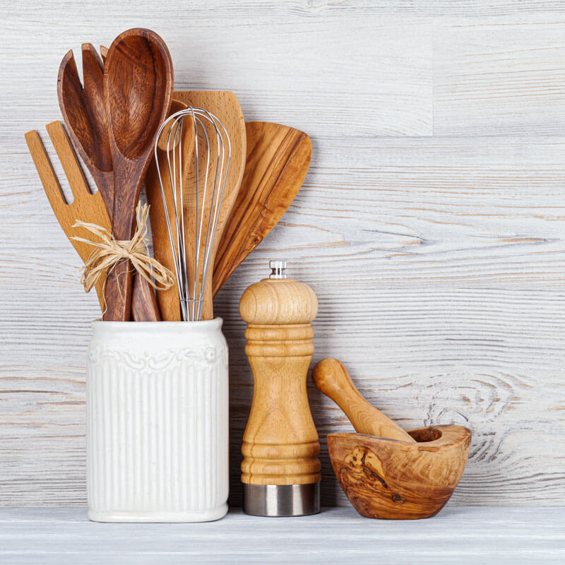 wooden-kitchen-tools-and-bowl-on-a-white-background