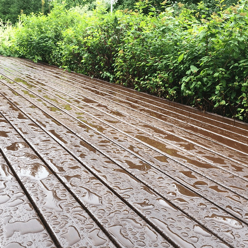 wet-washed-wooden-terrace-deck-with-greenery